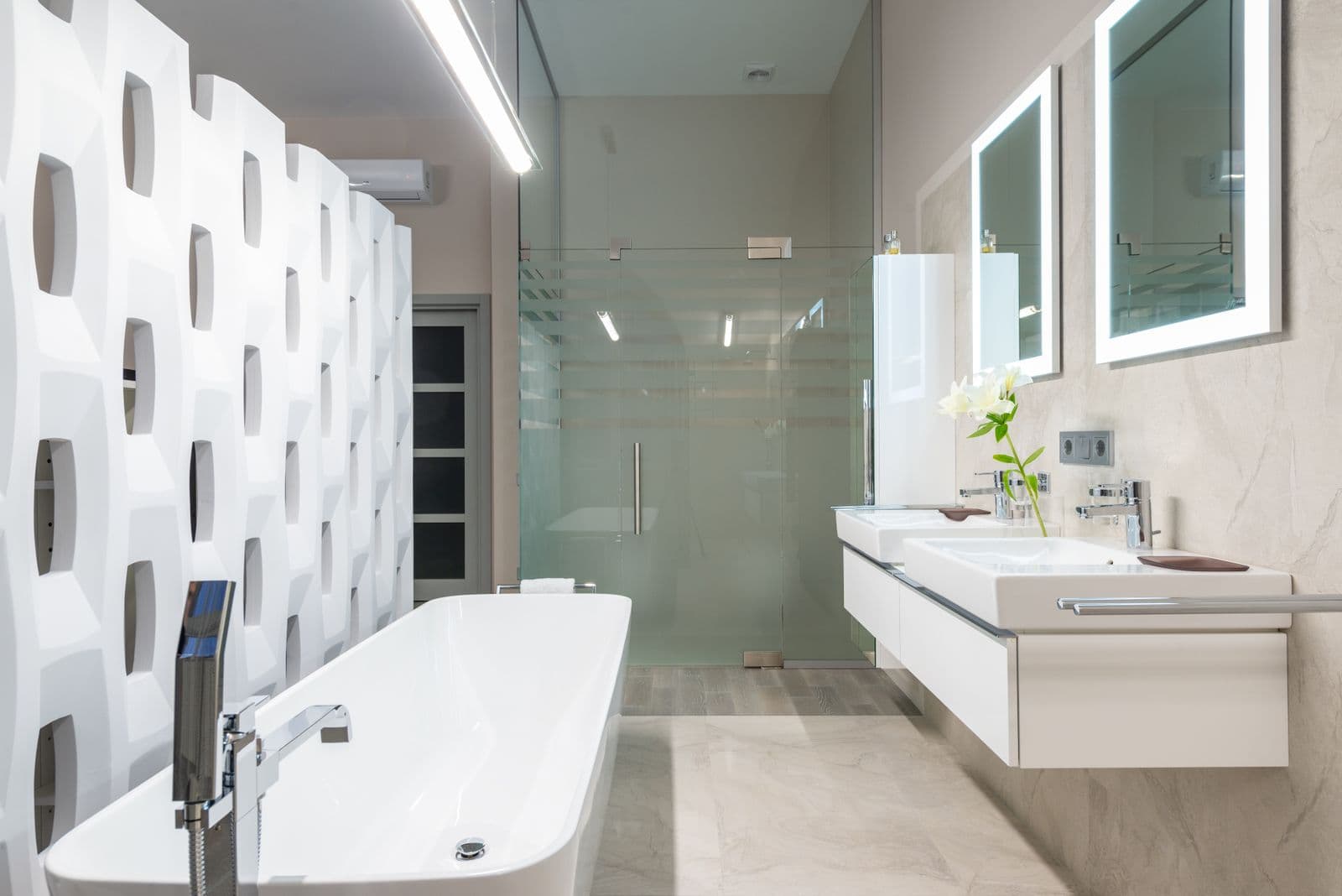 Modern bathroom with a white bath, twin basins and a glass shower enclosure — Bathrooms in Ipswich